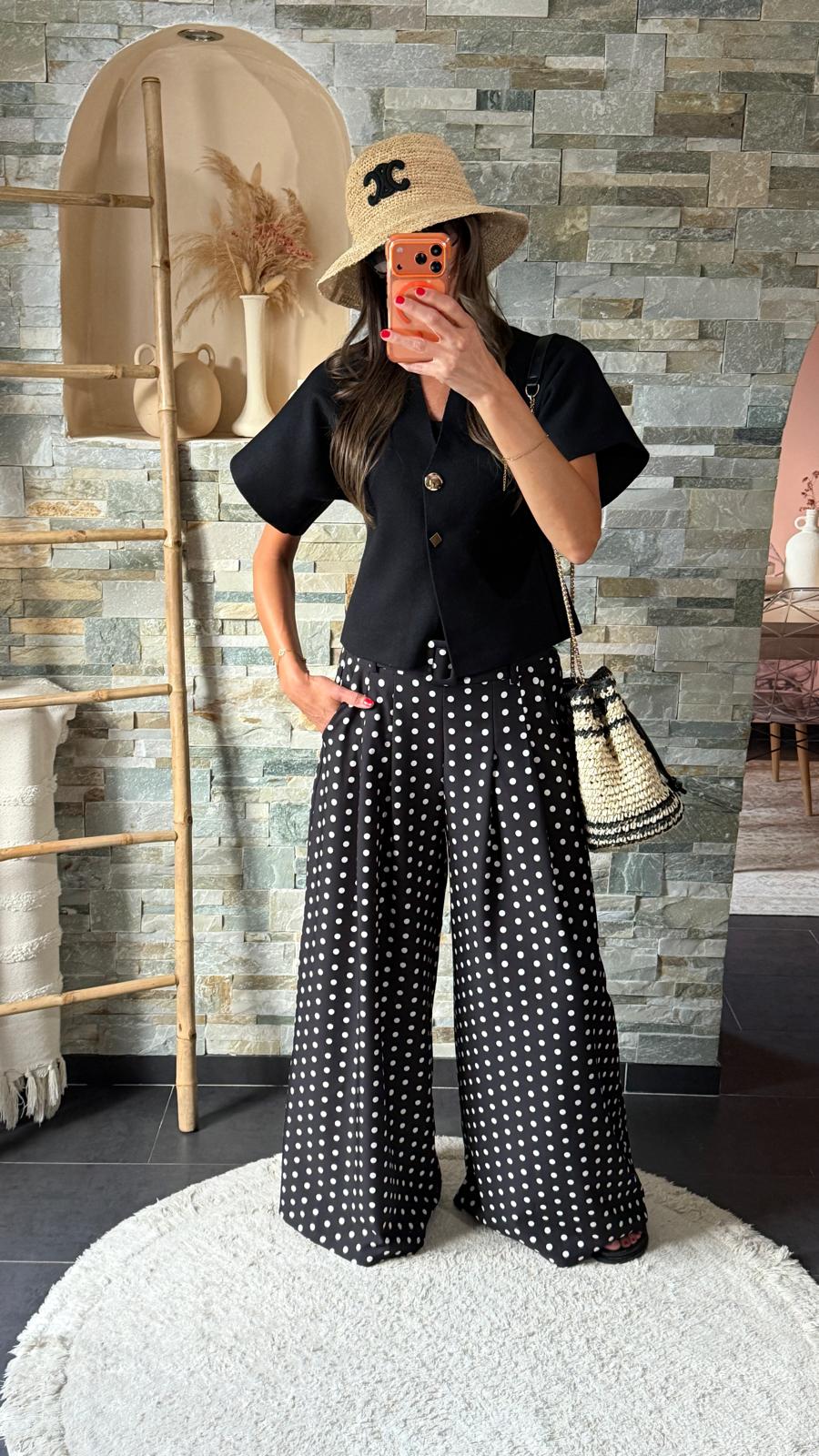 Black flared polka dot trousers