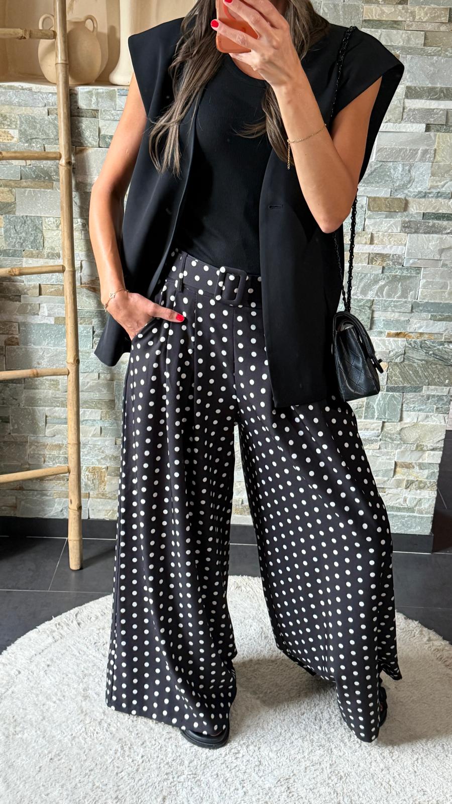 Black flared polka dot trousers